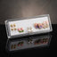 Gold Pink Purple Floral Enamel Pearl CZ 4-Pair Stud Earring Set flat lay on black velvet tray with grey fabric backdrop showing gold double ball studs pink tulip enamel studs white CZ pearl drop studs and large purple iridescent floral enamel petal stud with pink clover and CZ snowflake cluster with mirror reflections below