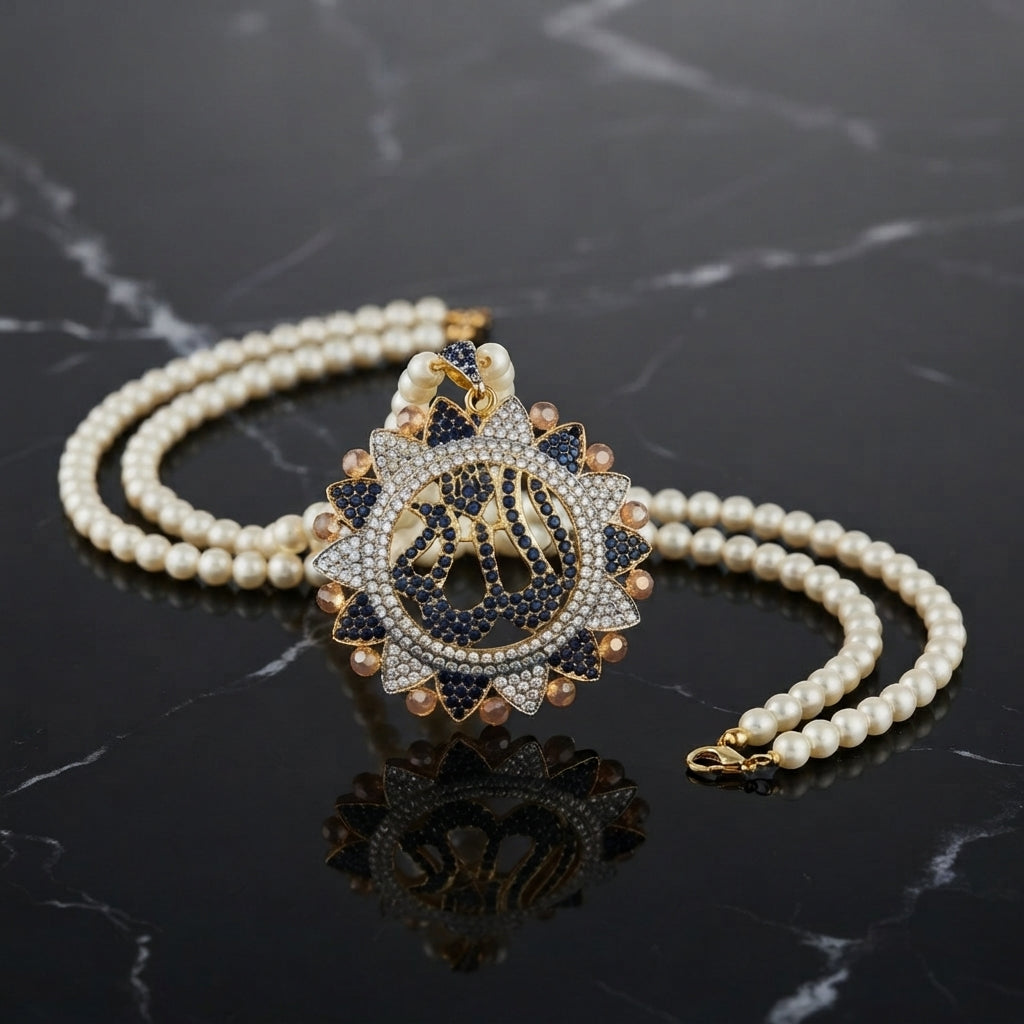 gold-plated double strand pearl necklace with a circular pendant featuring Arabic Allah calligraphy surrounded by a sunburst crystal halo, shown on a dark reflective surface.