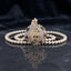 gold-plated double strand pearl necklace with a circular pendant featuring Arabic Allah calligraphy surrounded by a sunburst crystal halo, shown on a dark reflective surface.
