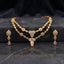 Gold Polki and Rose Quartz Double Layer Necklace and Drop Earrings Bridal Set — 22K antique gold-tone 2-piece Mughal bridal set with double-layer rigid polki simulant teardrop necklace with white CZ micro-pavé halos and rose quartz pear pendant drop and matching 3-tier polki and rose quartz drop earrings displayed on dark grey marble surface with black satin backdrop