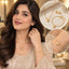 Gold Puffy Heart Pendant Necklace Bracelet and Earrings Set composite image showing Pakistani female model in ivory cream embroidered kurta wearing full 3-piece gold puffy heart set with fine satellite chain necklace and matching bracelet and stud earrings with top right inset product flat lay on white with gypsophila flowers and bottom right inset wrist bracelet closeup