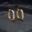Silver-tone rounded-rectangle hoop earrings with pavé-style clear stones.