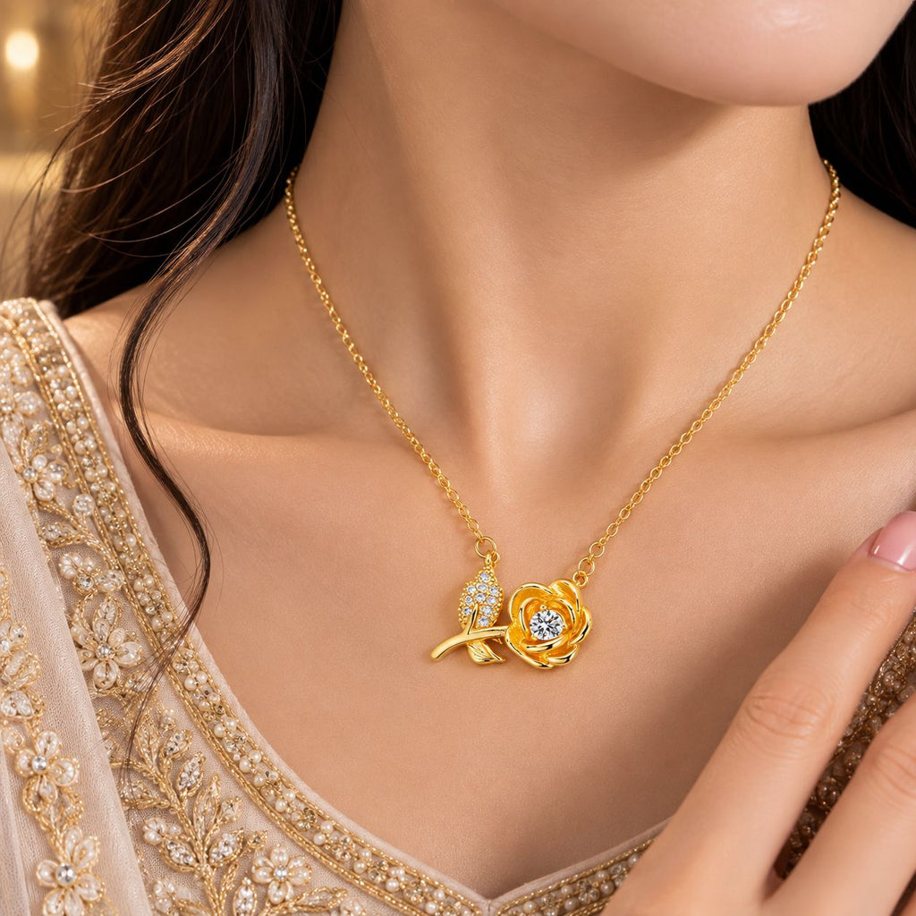 Gold Rose Bloom CZ Solitaire & Pavé Leaf Pendant Necklace worn by bridal model in cream pearl-embroidered lehenga close-up with gold bokeh backdrop