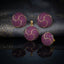 Gold-Tone Ruby Red CZ Swirl Dome Pendant & Earrings Jewelry Set on dark brocade fabric surface