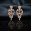 Gold Ruby and White CZ Marquise Floral Oval Lattice Drop Earrings — 18-22K gold-tone statement bridal earrings with pear CZ daisy floral stud open oval marquise trellis lattice body with ruby CZ intersection points and marquise white CZ windows and small daisy pear CZ drop displayed on dark black mirror surface with charcoal satin backdrop