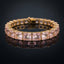 Gold-Tone Pink Princess-Cut CZ Tennis Bracelet product shot on dark surface