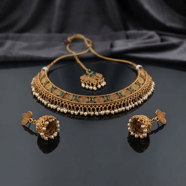 Gold-Tone Rajwari Spiral Choker Necklace, Jhumka Earrings & Maang Tikka Bridal Set flat lay