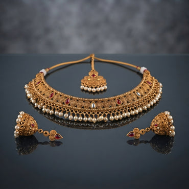 Gold-Tone Antique Rajwari Ruby & Pearl Choker Necklace, Jhumka Earrings & Maang Tikka Set flat lay