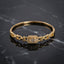 Gold-Tone Baguette & Round CZ Rectangular Charm Chain Link Bangle Bracelet product shot on black marble surface