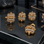 Gold-tone matching earrings, ring and locket with champagne-coloured floral clusters, round centres and two curved rows of clear accents.