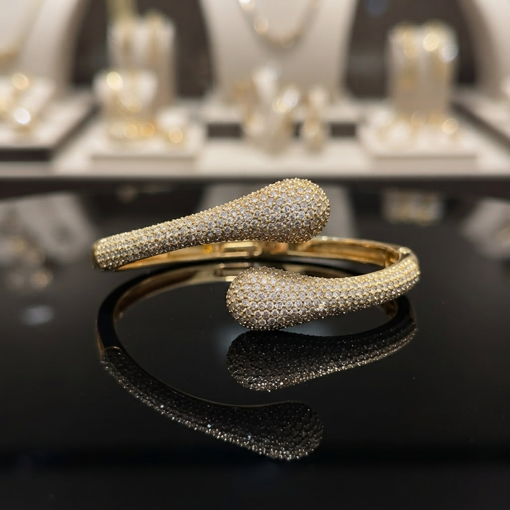 Silver-tone CZ pavé double teardrop bypass bangle with full micro-pavé CZ coverage