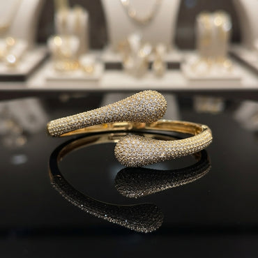 Silver-tone CZ pavé double teardrop bypass bangle with full micro-pavé CZ coverage