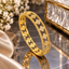 Gold-Tone Floral Openwork Bangle with Clear Accents