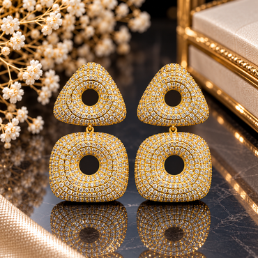 Gold-tone drop earrings with clear-accent rounded triangular tops, rounded square drops and circular open centres.