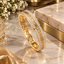 Gold-Tone Greek Key Bangle with Clear Accents