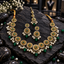 Gold-tone necklace, matching double-medallion earrings and three-medallion bindia with green centres, clear borders, white pearl-look beads and green drops.