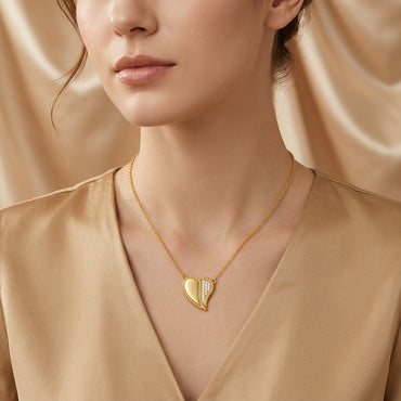 Gold-Tone Half CZ Pavé Rope Twist Heart Pendant Necklace worn by model on beige background