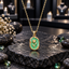 Gold-tone tulip pendant necklace with a textured green background, raised flower and leaf motif, and rounded rectangular border.