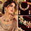 Gold-Tone Multi-Stone Floral Pearl and Polki CZ Necklace and Earrings Set shown in three views: Pakistani bridal model wearing set with pink embroidered lehenga in warm candlelit setting top right velvet jewellery box display of full necklace and earrings set on burgundy velvet bottom right macro closeup of gold-tone floral clusters with white pearls emerald-green faceted drops coral-red oval beads peach champagne beads and marquise CZ petals