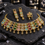 Gold-tone multicolour three-row rectangular halo necklace with teardrop fringe, matching long earrings and a smaller four-panel coordinating piece.