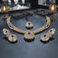 Gold-Tone Red Accent Necklace Set with Maang Tikka & Earrings