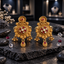 Gold-tone drop earrings with red-centred round tops, red and clear-looking floral medallions, hanging bead clusters and central red-accented teardrop pendants.