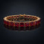 Gold-Tone Ruby Red Princess-Cut CZ Tennis Bracelet product shot on dark surface