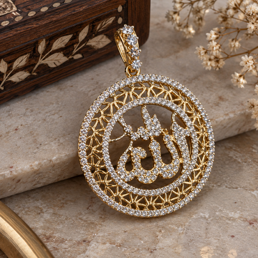 Gold-tone round Allah calligraphy pendant with clear accents, two circular borders, geometric openwork, and an embellished hanging loop.
