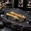 Gold-Tone Twin Snake Bracelet with Green Eyes