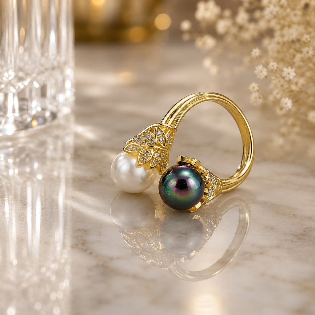 Gold-Tone White & Black Pearl CZ Lotus Crown Toi et Moi Bypass Ring product shot on marble surface