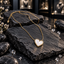 Gold-tone necklace with a white iridescent pearl-look heart pendant, smooth gold-tone border, fine chain and extension chain.