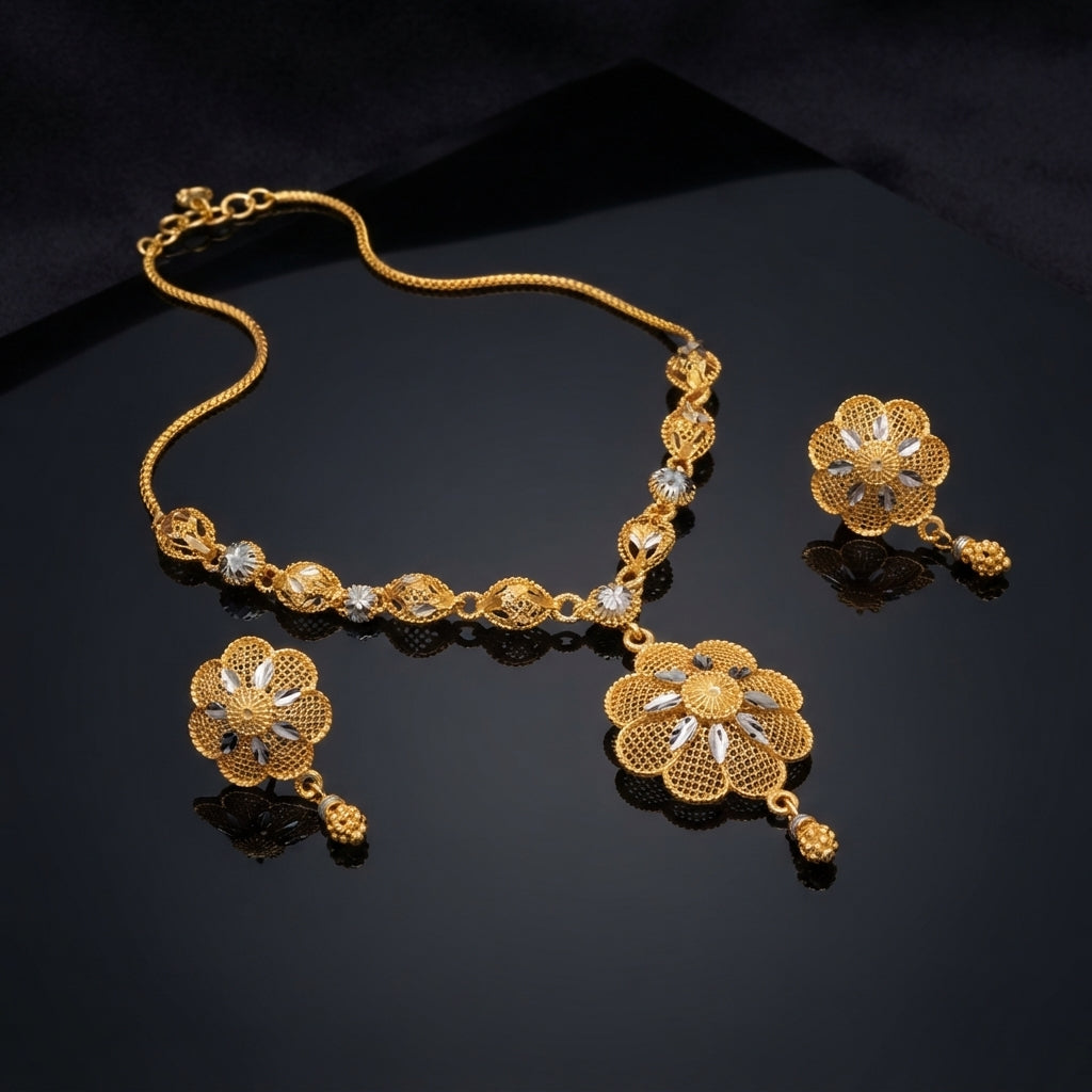 Gold Two-Tone Filigree Rose Pendant Necklace and Berry Drop Earrings Set — 22K antique gold-tone 2-piece set with diamond rhombus station chain with rhodium marquise leaf accents large 8-petal open filigree rose pendant with rhodium marquise star center and triple gold berry drop and matching round dome filigree rose berry drop earrings displayed on dark mirror black surface with mirror reflection