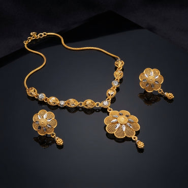 Gold Two-Tone Filigree Rose Pendant Necklace and Berry Drop Earrings Set — 22K antique gold-tone 2-piece set with diamond rhombus station chain with rhodium marquise leaf accents large 8-petal open filigree rose pendant with rhodium marquise star center and triple gold berry drop and matching round dome filigree rose berry drop earrings displayed on dark mirror black surface with mirror reflection