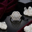 22K Gold-Tone White CZ Floral Cluster Double Scalloped Halo & Pavé Shoulder Bridal Ring on black mirror surface with deep burgundy velvet fabric and white crystal quartz cluster backdrop