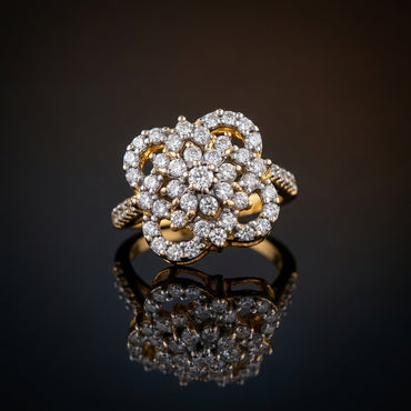 22K Gold-Tone White CZ Open Petal Rose Cluster & Pavé Twisted Rope Shoulder Cocktail Ring on dark grey mirror surface with warm gold bokeh light backdrop
