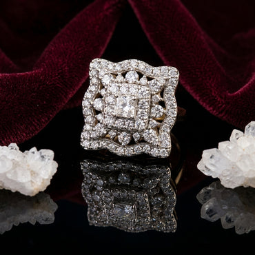 22K Gold-Tone White CZ Princess Cluster Double Square Scalloped Halo Open-Work Bridal Ring on black mirror surface with deep burgundy velvet fabric and white crystal quartz clusters backdrop