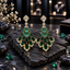 Pair of gold-tone chandelier earrings with cascading green teardrop accents and clear sparkling borders.