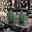 Pair of rounded teardrop earrings with green round accents in a gold-tone setting, pointed tops and wider curved bases.
