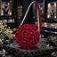 Handmade red rose-shaped bag with layered petal detailing, clear sparkling accents and a white pearl-look and red strap.