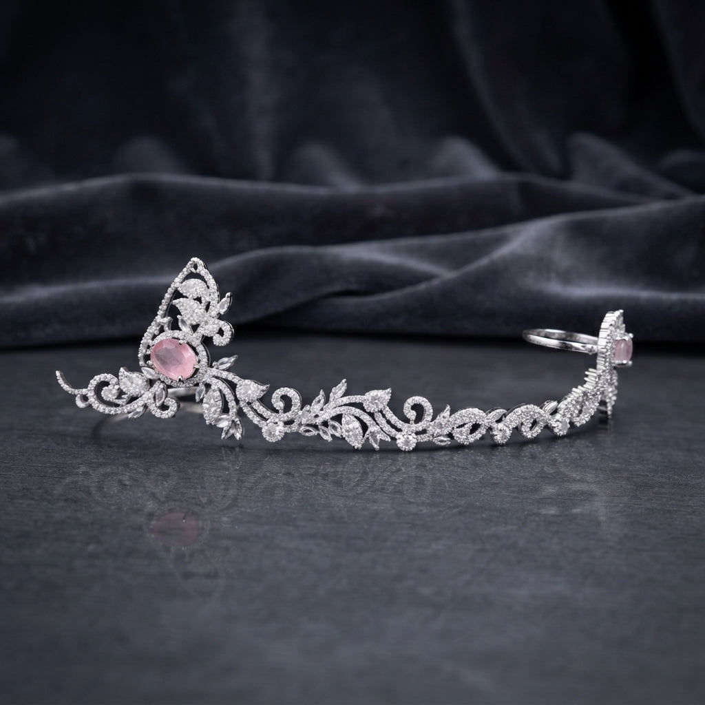Silver Rose Pink CZ Floral Vine Crown Tiara and Mathapatti Bridal Head Piece on dark charcoal satin backdrop showing rhodium silver open-ended arc tiara with pointed arch crown centre large rose pink oval CZ halo focal stone scrolling marquise leaf vine band and rose pink CZ halo tip ends