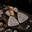 Silver CZ statement earrings with rounded triangular baguette-stone drops, pavé-style borders and teardrop-shaped tops