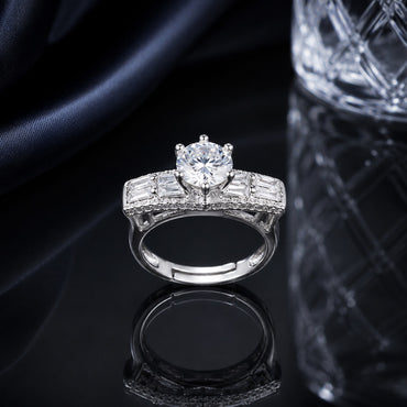 Silver CZ solitaire statement ring with round center stone and baguette side detailing