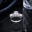 Silver CZ solitaire statement ring with round center stone and baguette side detailing
