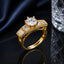 Golden CZ solitaire statement ring with round center stone and baguette side detailing