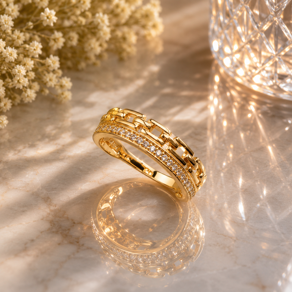 Elegant gold-tone chain link crystal ring with sparkling stone detailing