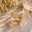 Elegant gold-tone chain link crystal ring with sparkling stone detailing