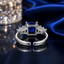 Back view of navy blue CZ princess cut baguette accent adjustable open-band ring in silver-tone finish showing the open adjustable band