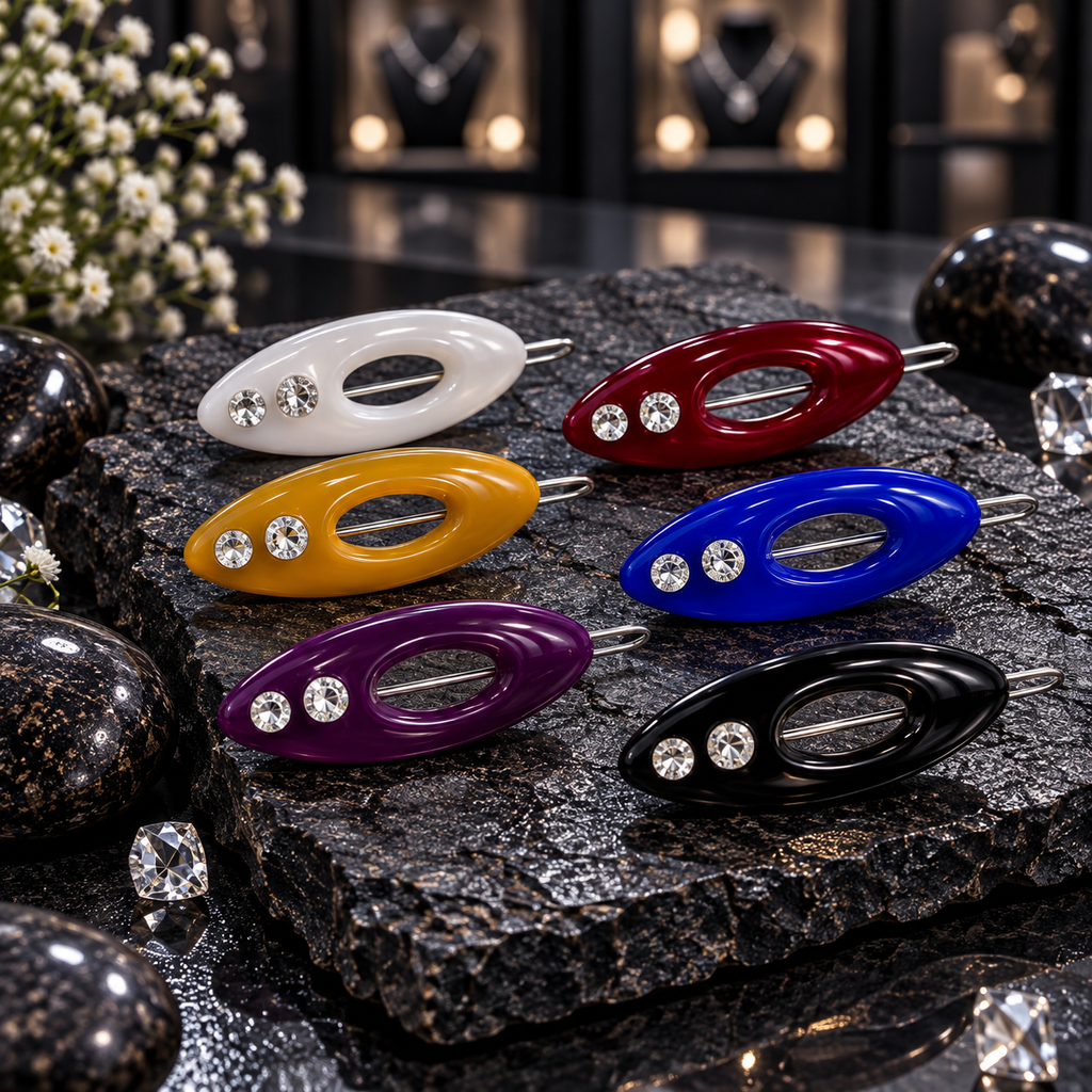 Six oval hijab pins with open centres and two clear decorative accents each, in white, burgundy, mustard yellow, royal blue, purple and black.