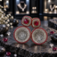 Gold-tone earrings with ruby-coloured cushion-shaped centres, clear-accent round disc drops and matching deep-red borders.