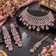 Pink floral bridal necklace set with matching earrings and maang tikka.